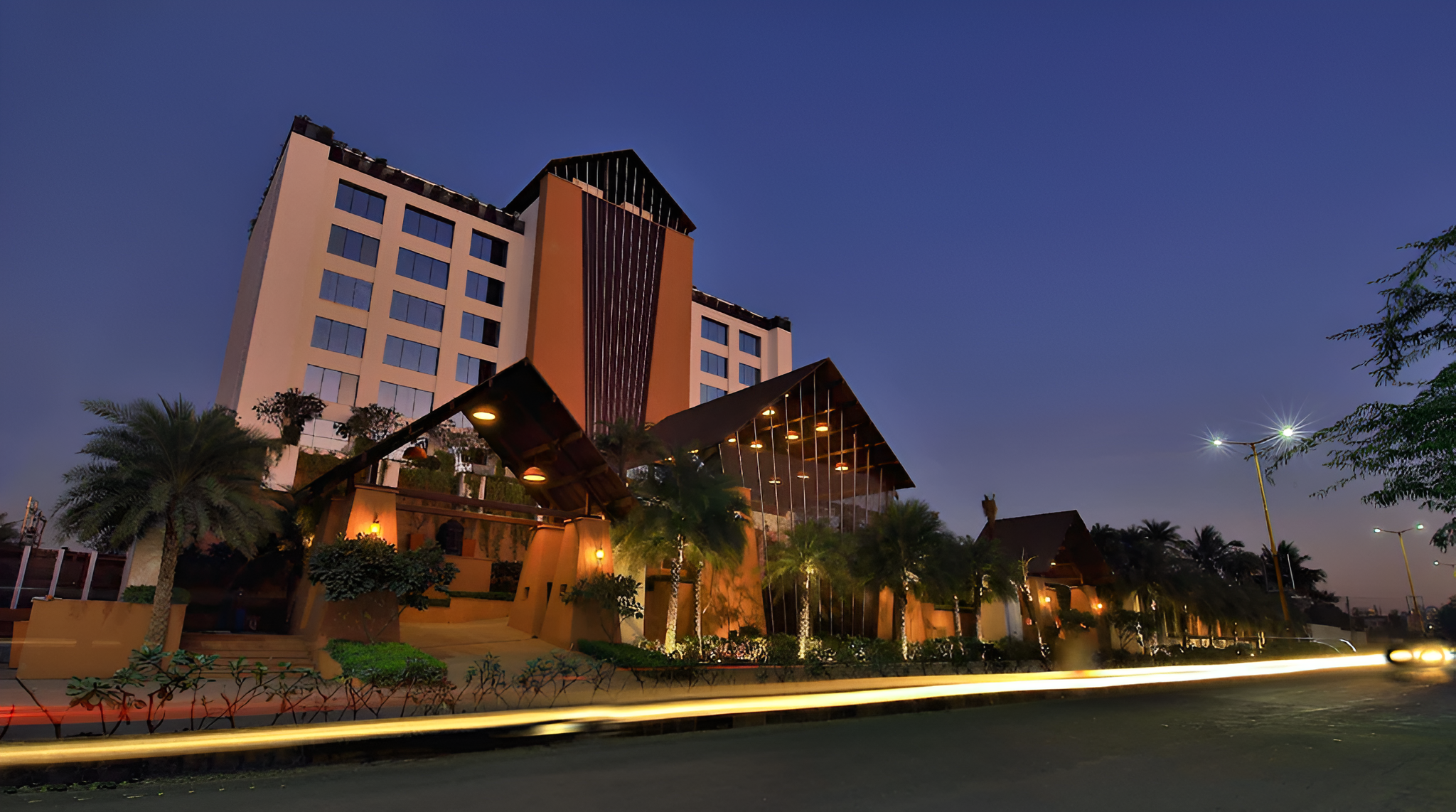 Luxury hotel exterior with modern architecture and beautiful landscaping